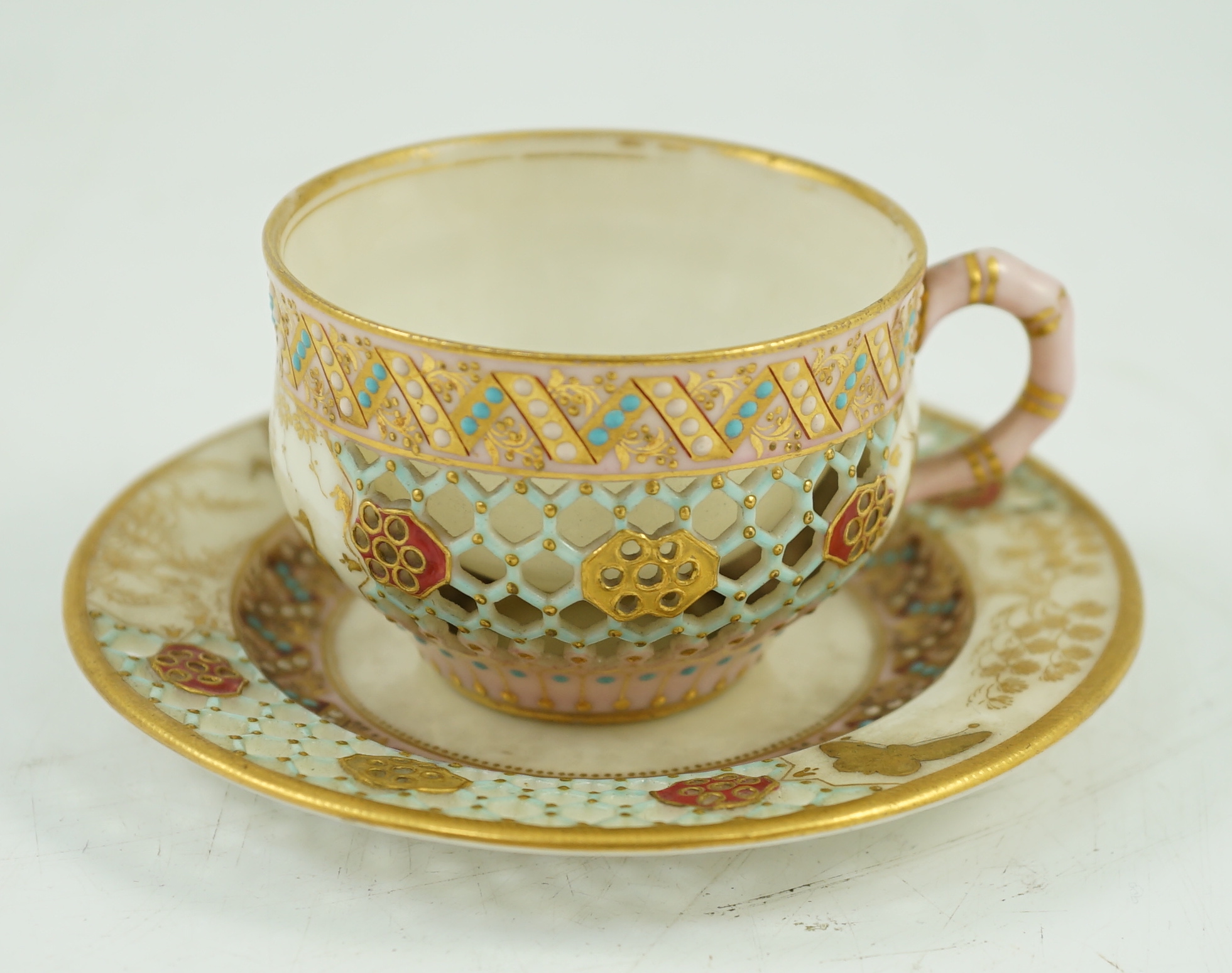 A Royal Worcester reticulated miniature cabinet cup and saucer, late 19th century